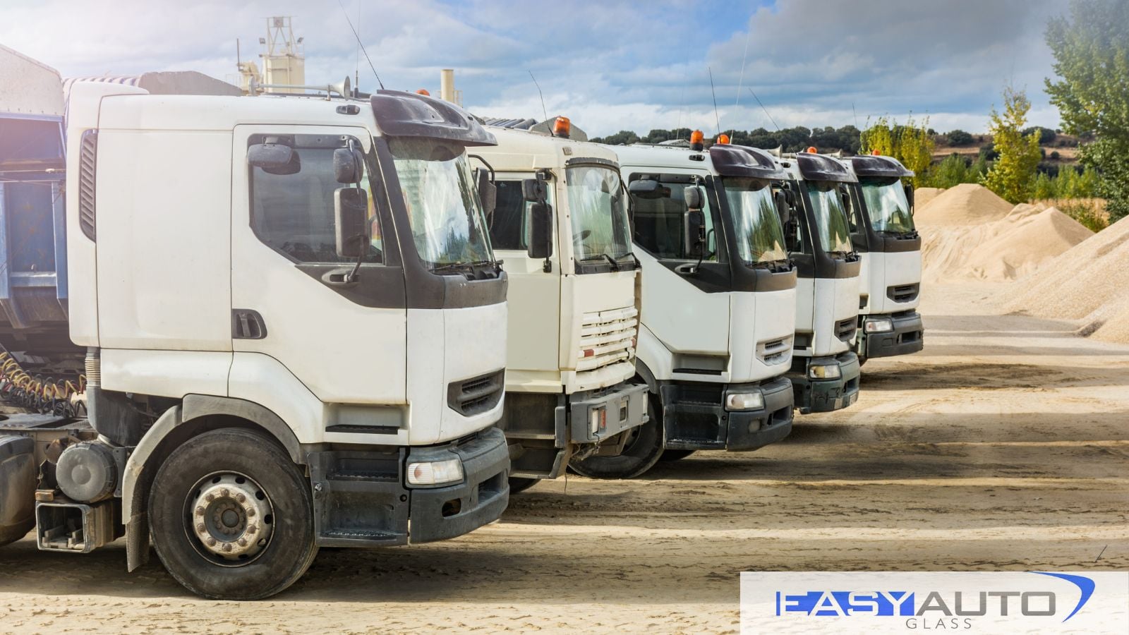 A fleet of commercial vehicles lined up.
